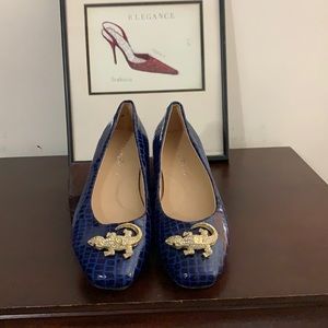 A croc print pair of blue flats